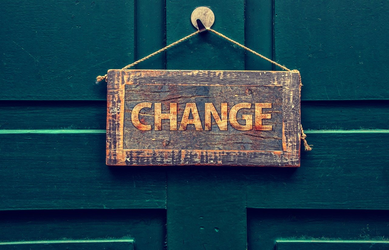 Change sign hanging on a front door to a home