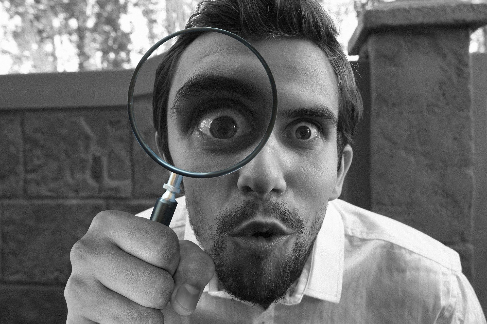 Man investigating leasehold property matters with a magnifying glass