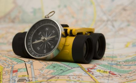 Binoculars, map and compass