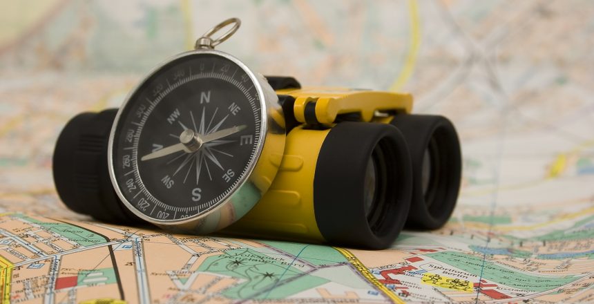 Binoculars, map and compass