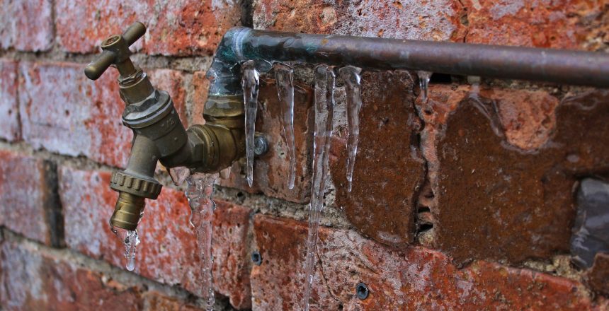 Frozen outside pipe and tap on residential brick property