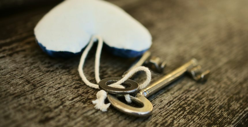 Keys to a newly bought leasehold property with a heart keyring