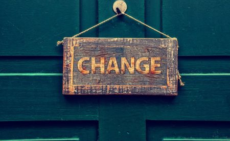 Change sign hanging on a front door to a home