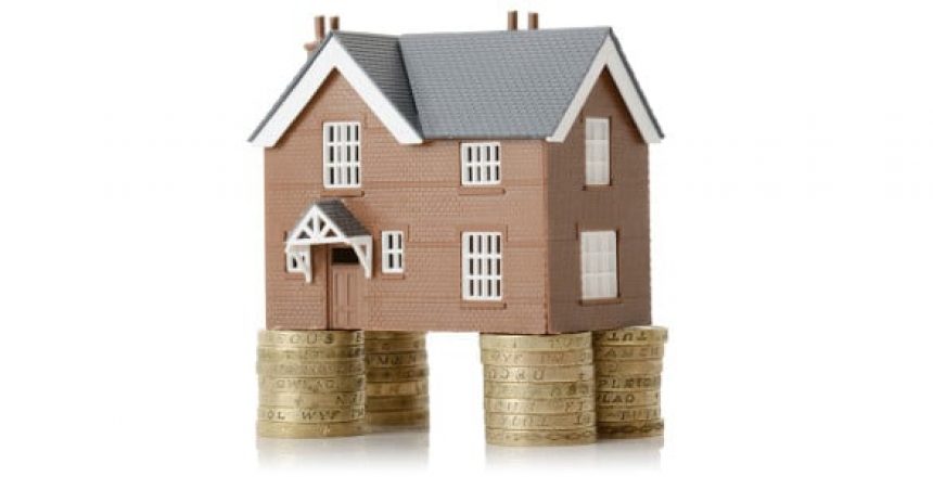 Residential property sitting on stacks of coins